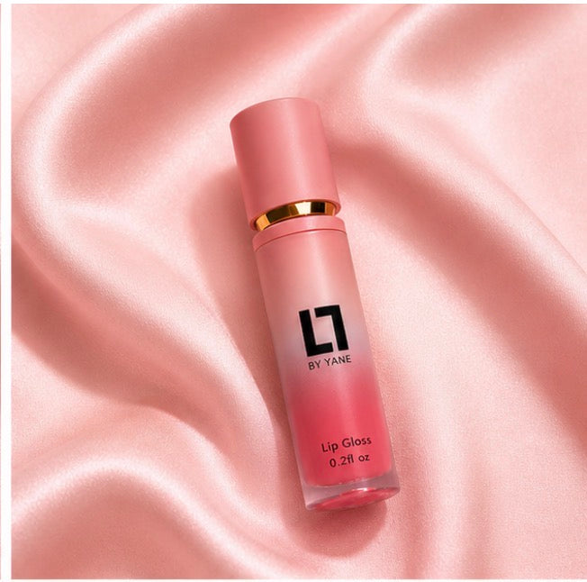 Lips and Lashes by Yane Lip Gloss in Blow A Kiss on pink satin