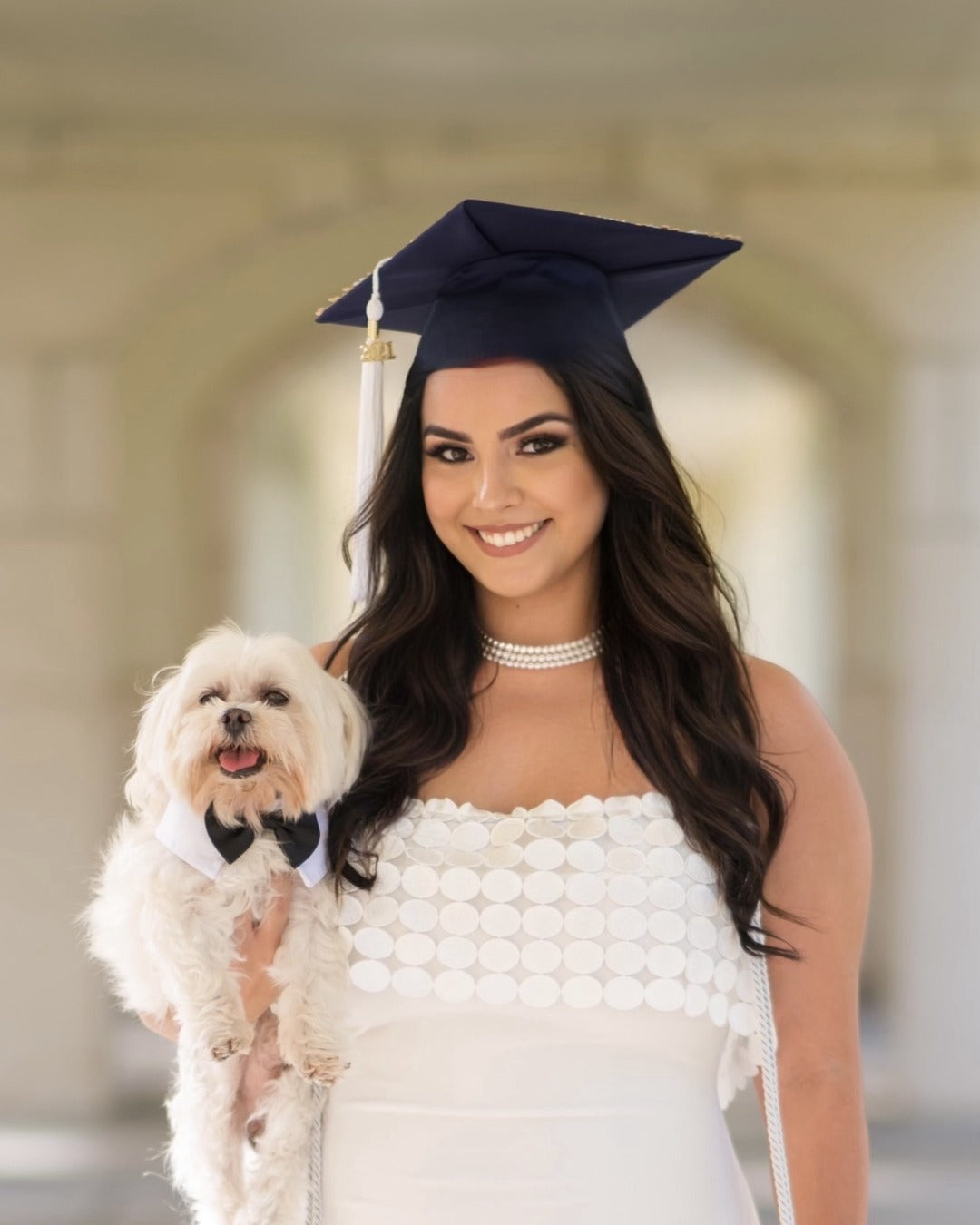 Graduation cap and gown with puppy, makeup by Lips and Lashes by Yane