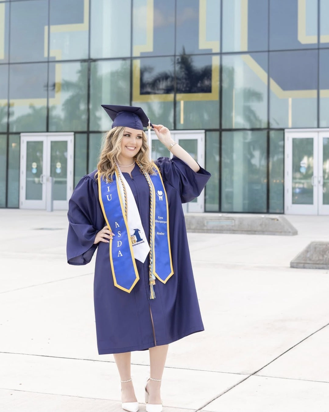 FIU graduation cap and gown portrait, makeup by Lips and Lashes by Yane